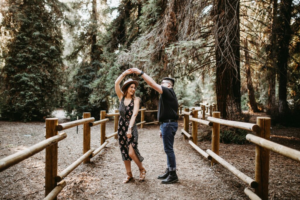 man and woman dancing outside