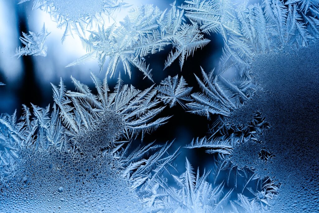 close up of snow frozen on window